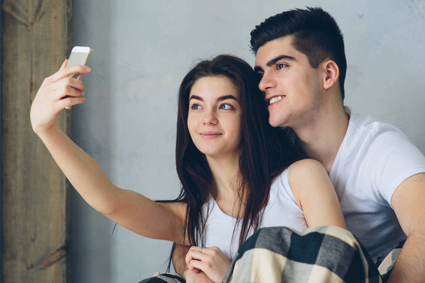 Man and woman do selfie at home - Fotoğraf, Görsel