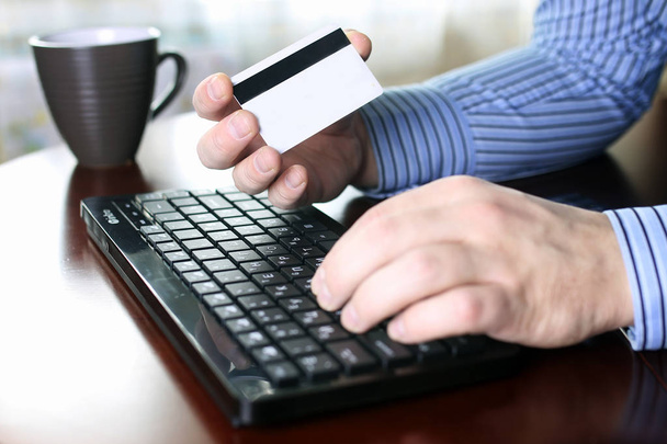 man pays for online purchases with a credit card - Photo, Image