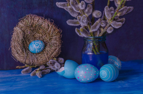  Blue Easter egg in the nest  and  branch of a willow - 写真・画像