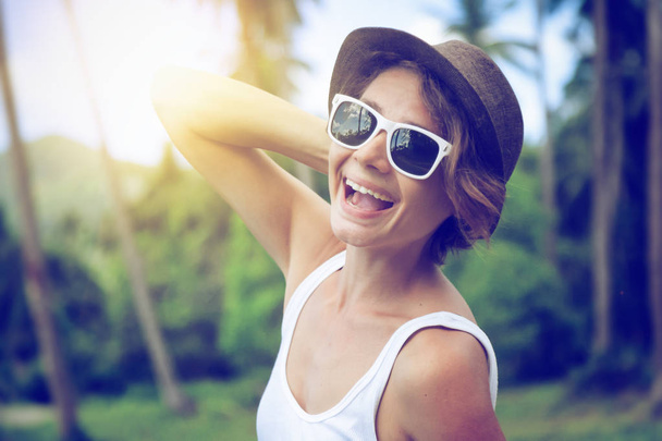 young beautiful hipster woman on tropical ,hat,  sunglasses, sty - Fotoğraf, Görsel
