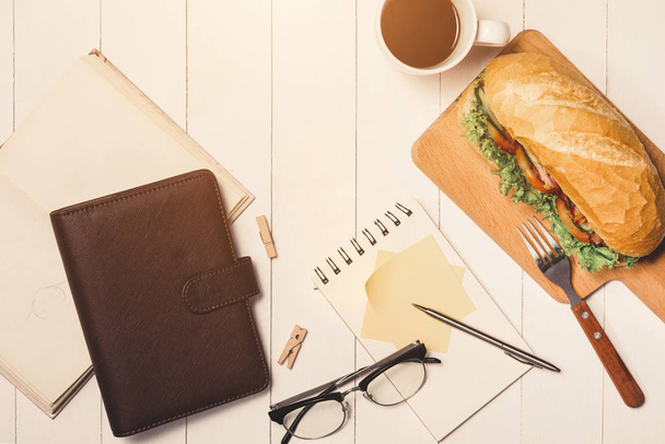 sandwich with coffee, phone and notepad - Photo, image