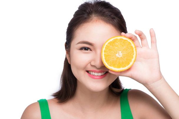 girl holding orange slice - Foto, imagen