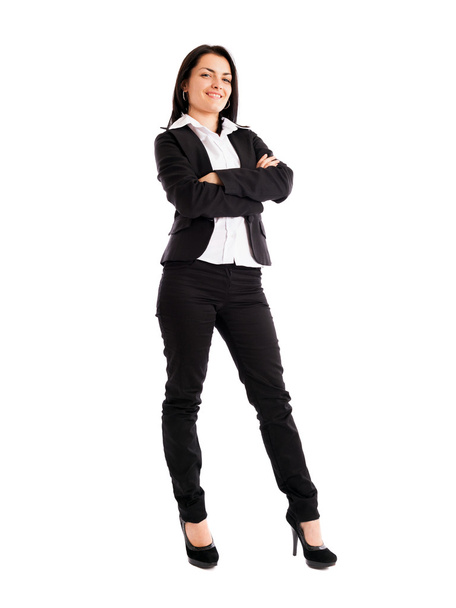 Young businesswoman standing with crossed arms isolated on white - Фото, зображення