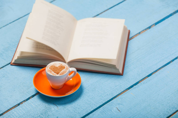 photo of cup of coffee and opened book - Fotoğraf, Görsel