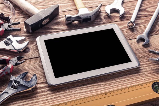 Variety of tools of builder and tablet pc - Foto, Imagen