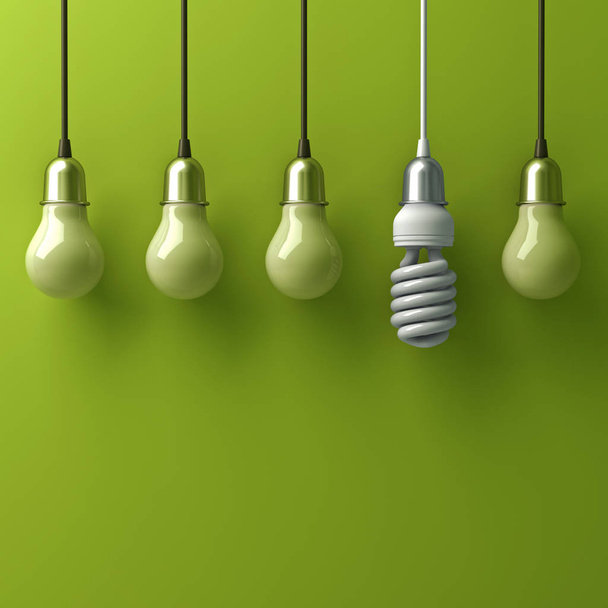 Una lampadina a risparmio energetico eco appesa diversa e si distingue dalle vecchie lampadine ad incandescenza con riflessione su sfondo verde, individualità e diverso concetto di idea creativa. Rendering 3D
 - Foto, immagini