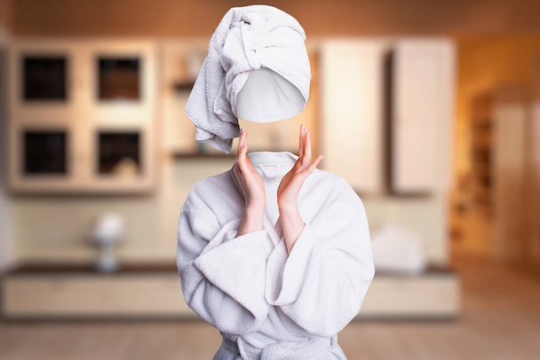 woman in white bathrobe with invisible face - Zdjęcie, obraz