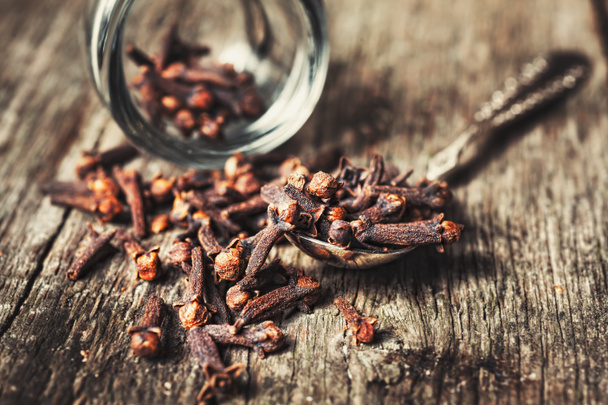 Cloves, old wooden background - Photo, Image