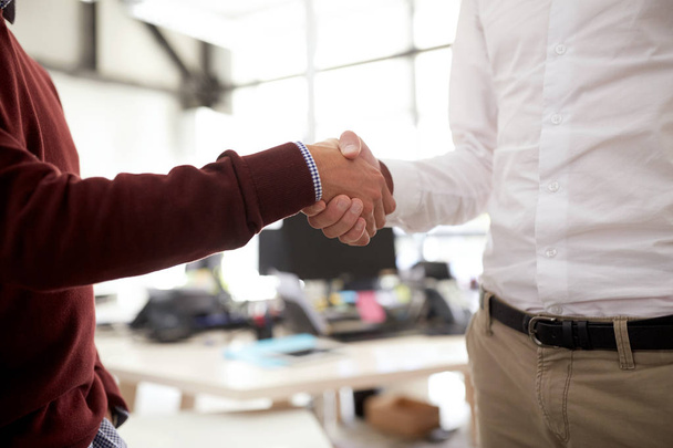 businessmen making handshake at office - Fotó, kép
