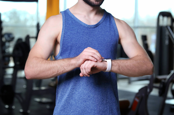 Young man with fitness tracker  - Foto, afbeelding