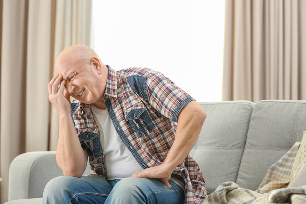 Senior man suffering from headache   - Фото, зображення