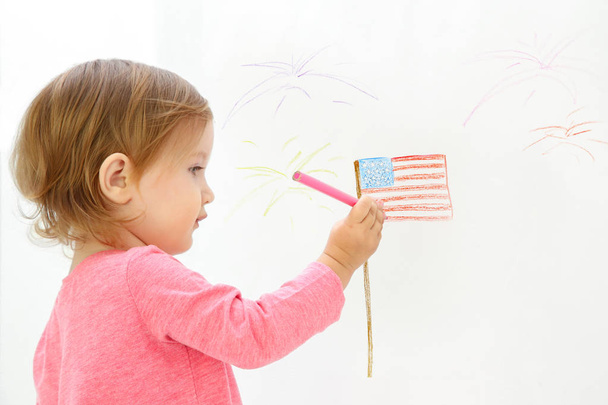 Little girl drawing USA flag on white background - Foto, Imagem