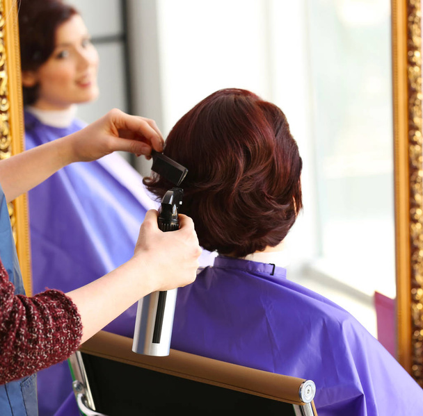 Hairdresser making beautiful haircut - Fotó, kép
