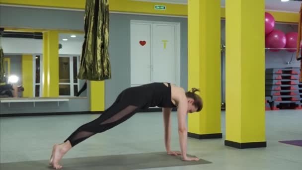 Two combined asanas, which are called the dog face up, the dog snouts down - Footage, Video