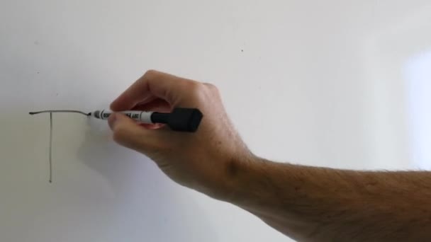 A man draws a dollar sign on a board  - Video, Çekim