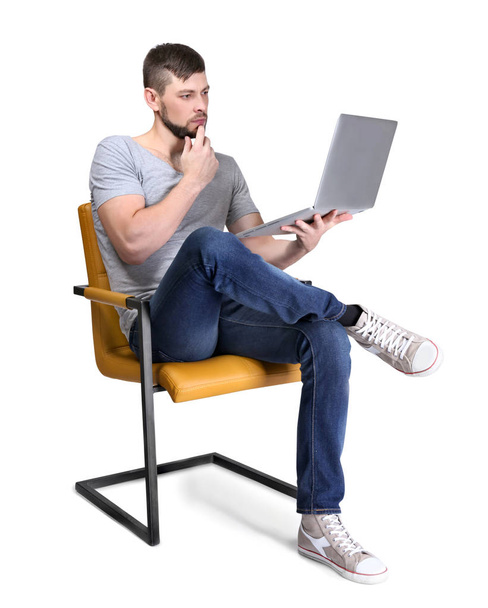 Handsome programmer with laptop on white background - Фото, изображение