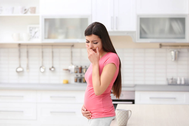 woman experiencing signs of pregnancy - Fotografie, Obrázek