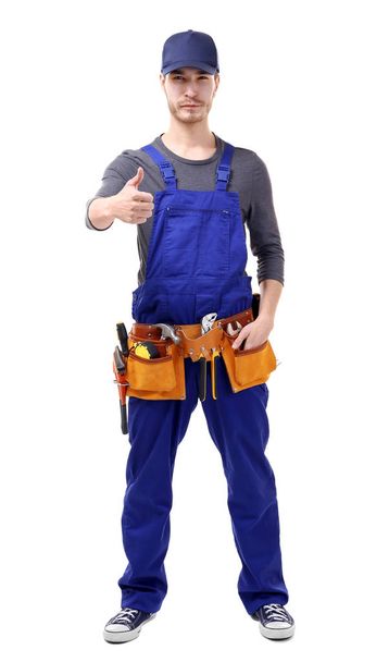 Young handsome plumber isolated on white - Fotografie, Obrázek