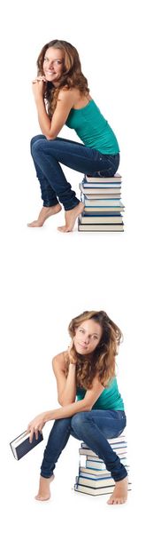 Student sitting on stack of books - Photo, Image