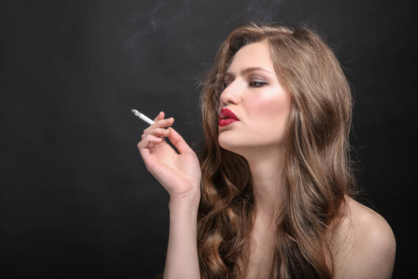 beautiful woman with cigarette  - Valokuva, kuva