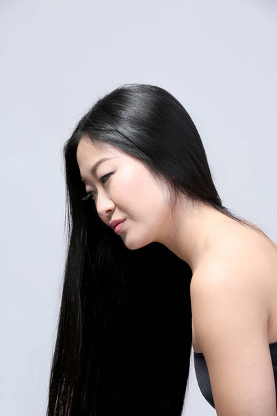 Beautiful woman with long straight hair - Valokuva, kuva