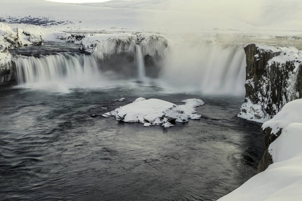 Godafoss waterfall in northern Iceland in winter, long exposure to get silky effect on the water - Foto, immagini