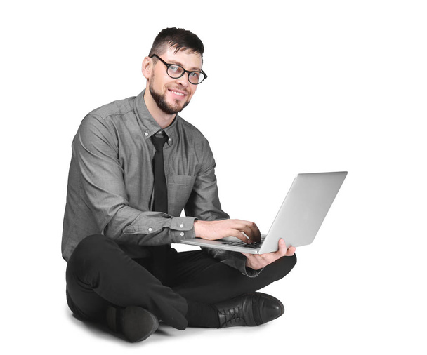 Handsome programmer with laptop on white background - Foto, afbeelding