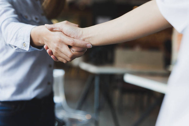 Business handshake. Two startup business woman shaking hands wit - Zdjęcie, obraz
