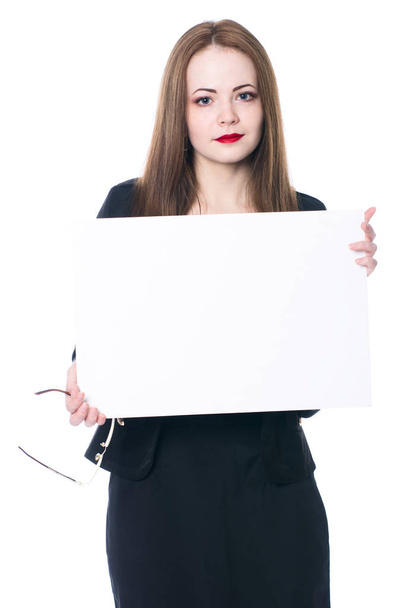 Pretty business woman holding a blank sign - Foto, imagen