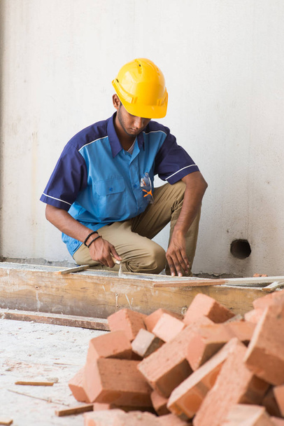 contruction worker laying bricks - Fotó, kép