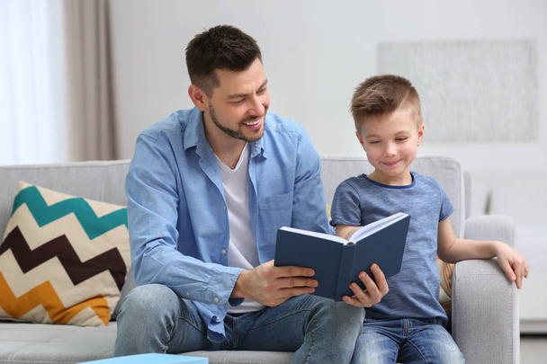 Dad and son reading book - Foto, imagen