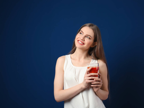 young woman with glass of juice - Φωτογραφία, εικόνα