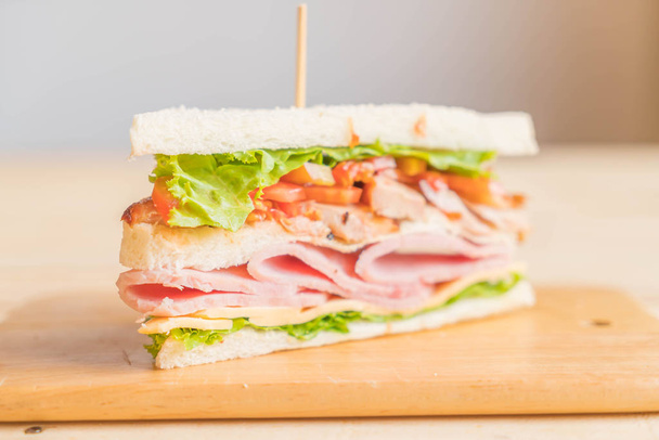 chicken ham sandwich on wood background - 写真・画像
