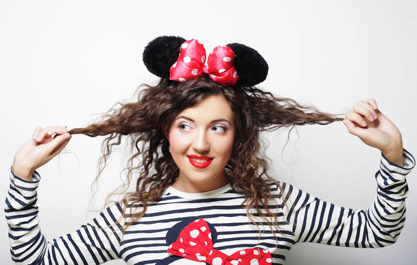 young woman with mouse ears over white background - Фото, изображение