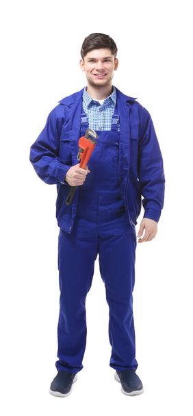 plumber holding pipe wrench - Zdjęcie, obraz