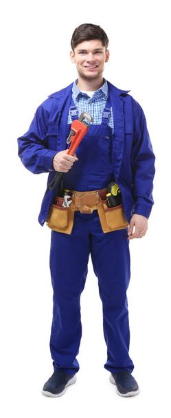 plumber holding pipe wrench - Фото, изображение