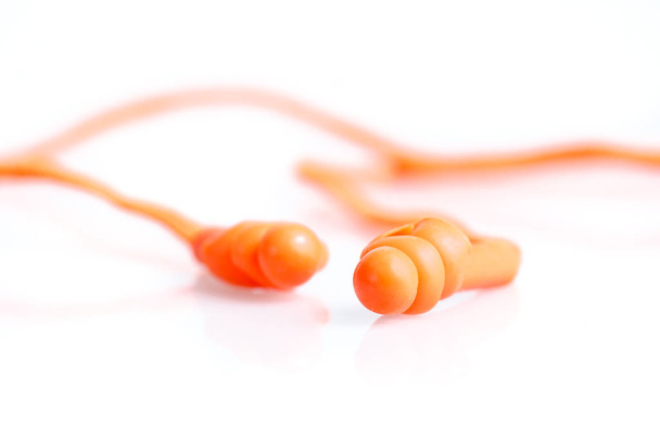 Orange pair of earplugs industrial equipment isolated on white - Foto, Bild