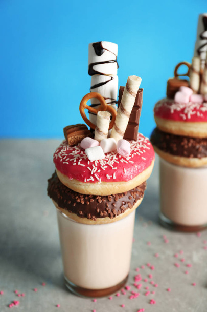 Milkshake, donut and sweets in glass  - Fotó, kép