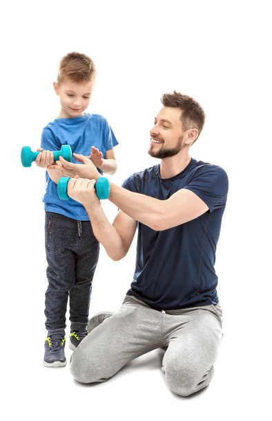 Father and son with dumbbells - Foto, Imagem