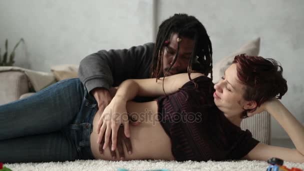 Young mixed race couple in love expecting a baby. - Footage, Video