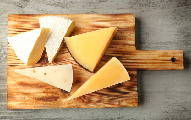 Board with delicious cheese   - 写真・画像