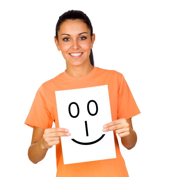 Girl holding a paper with a happy face painted - Photo, Image