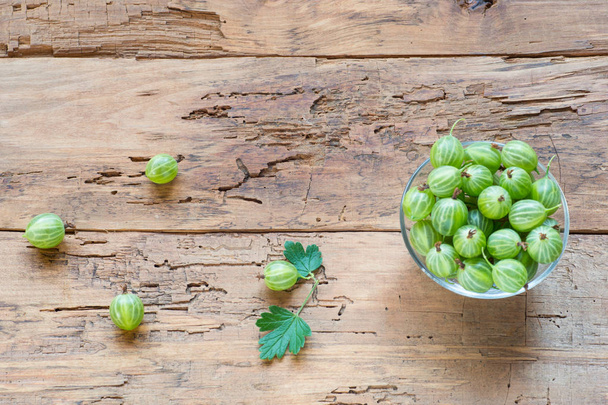 Fresh gooseberries in bowl on table close-up - Photo, Image