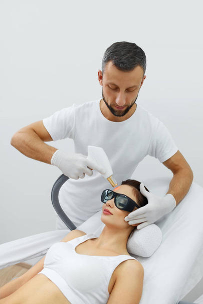 Beautician Using Laser For Skin Rejuvenation In Spa Salon - Fotó, kép