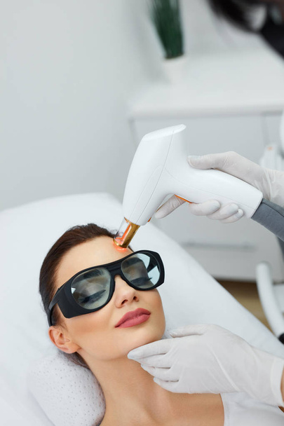 Beautiful Woman Receiving Beauty Treatment. Laser Procedures.  - Zdjęcie, obraz