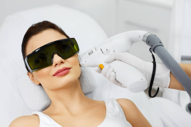 Laser Hair Removal. Woman At Spa Clinic Receiving Face Treatment - Fotografie, Obrázek
