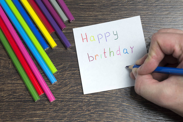 The inscription on the piece of paper with the birthday. - Foto, imagen