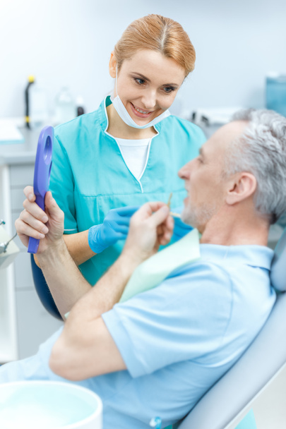 Dentist and patient in clinic  - Valokuva, kuva