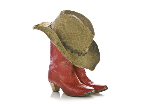 Dirty cowboy boots and hat isolated - 写真・画像