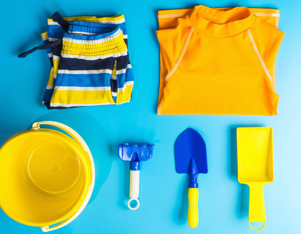 Boy Swiming suit and beach accesories flat lay for Summer vacation theme - Φωτογραφία, εικόνα